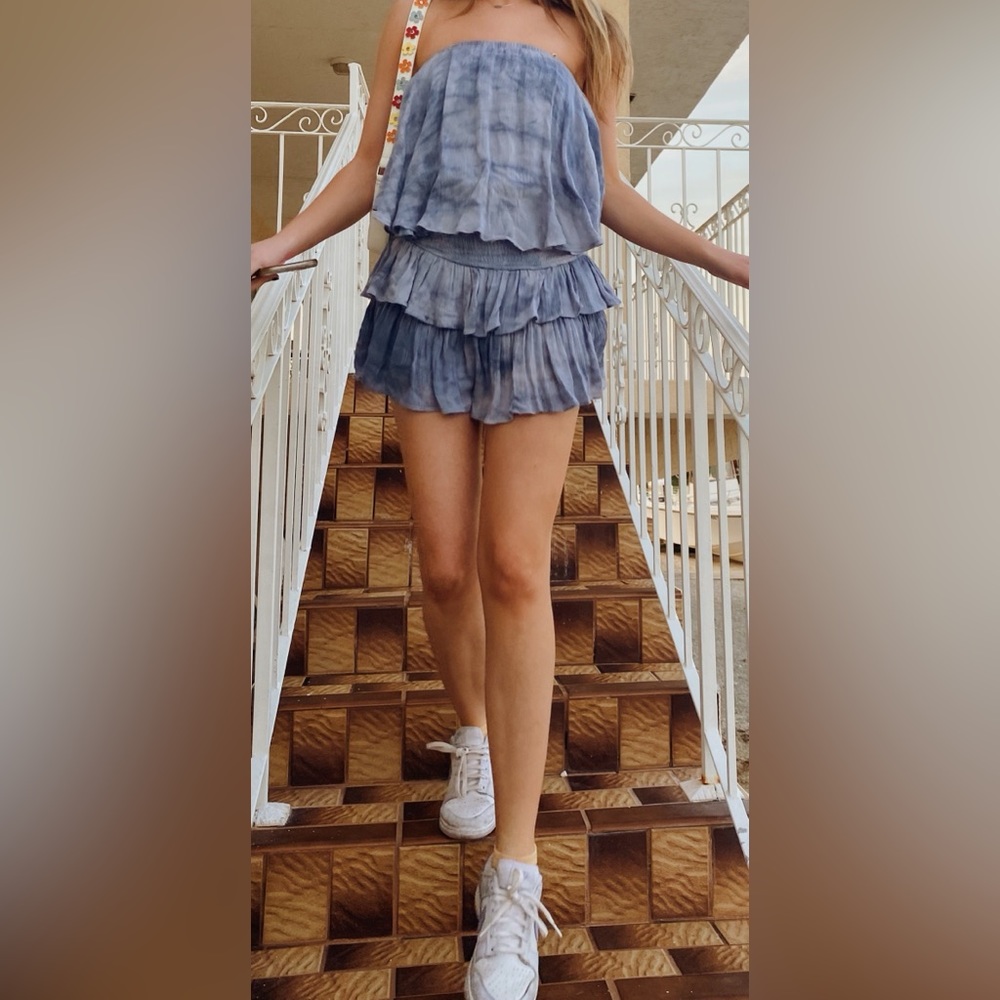 Tie Dye Ruffle Romper Dress with cutout back.